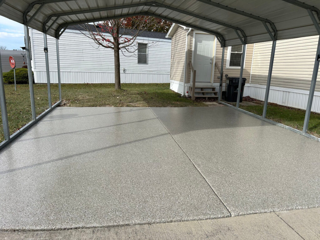 Concrete coating for driveway under carport.