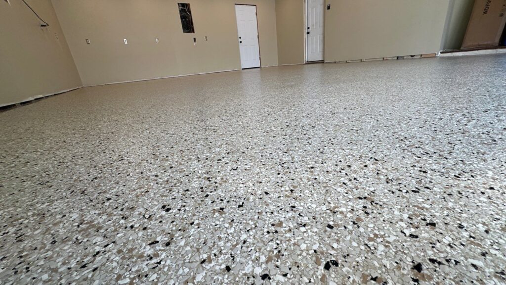 Professional applying concrete basement coating in Omaha NE