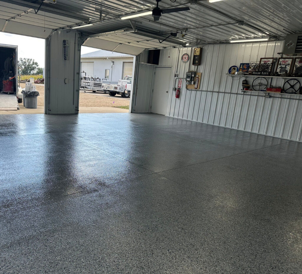 A pristine gray concrete garage coating on a residential garage floor, installed by TSR Concrete Coatings in Omaha, NE.